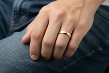 Gold ring on a white background
